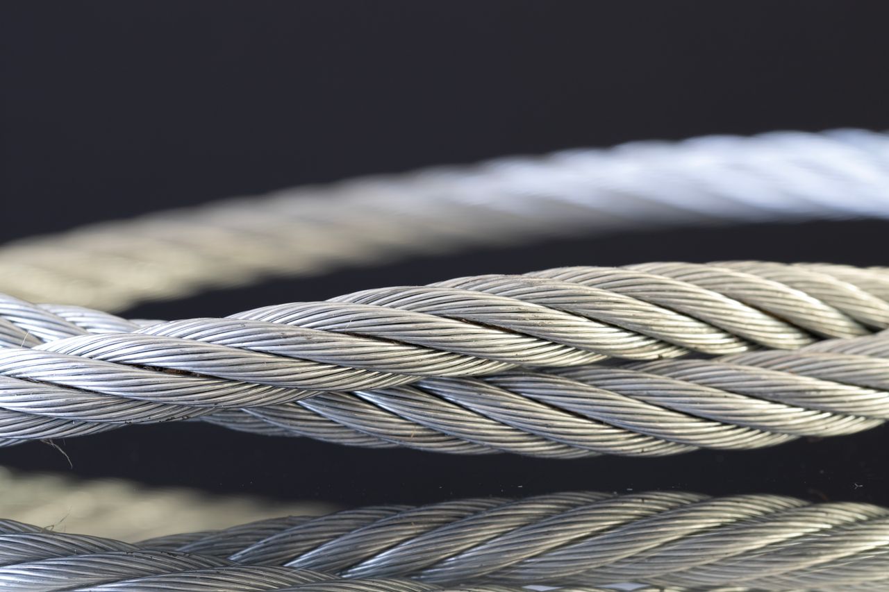 Detailed shot of twisted steel cables showcasing industrial strength and design.